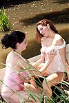 2 wet busty girls in a river